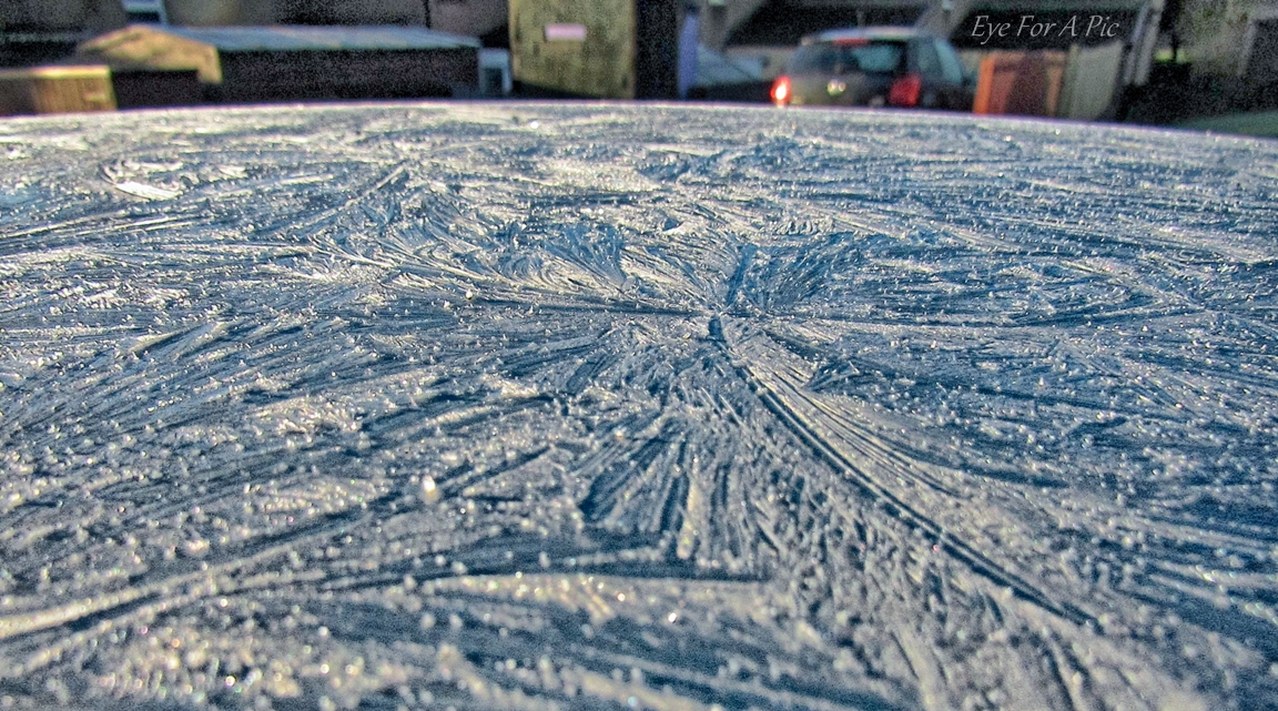 Early morning ice on roof of car